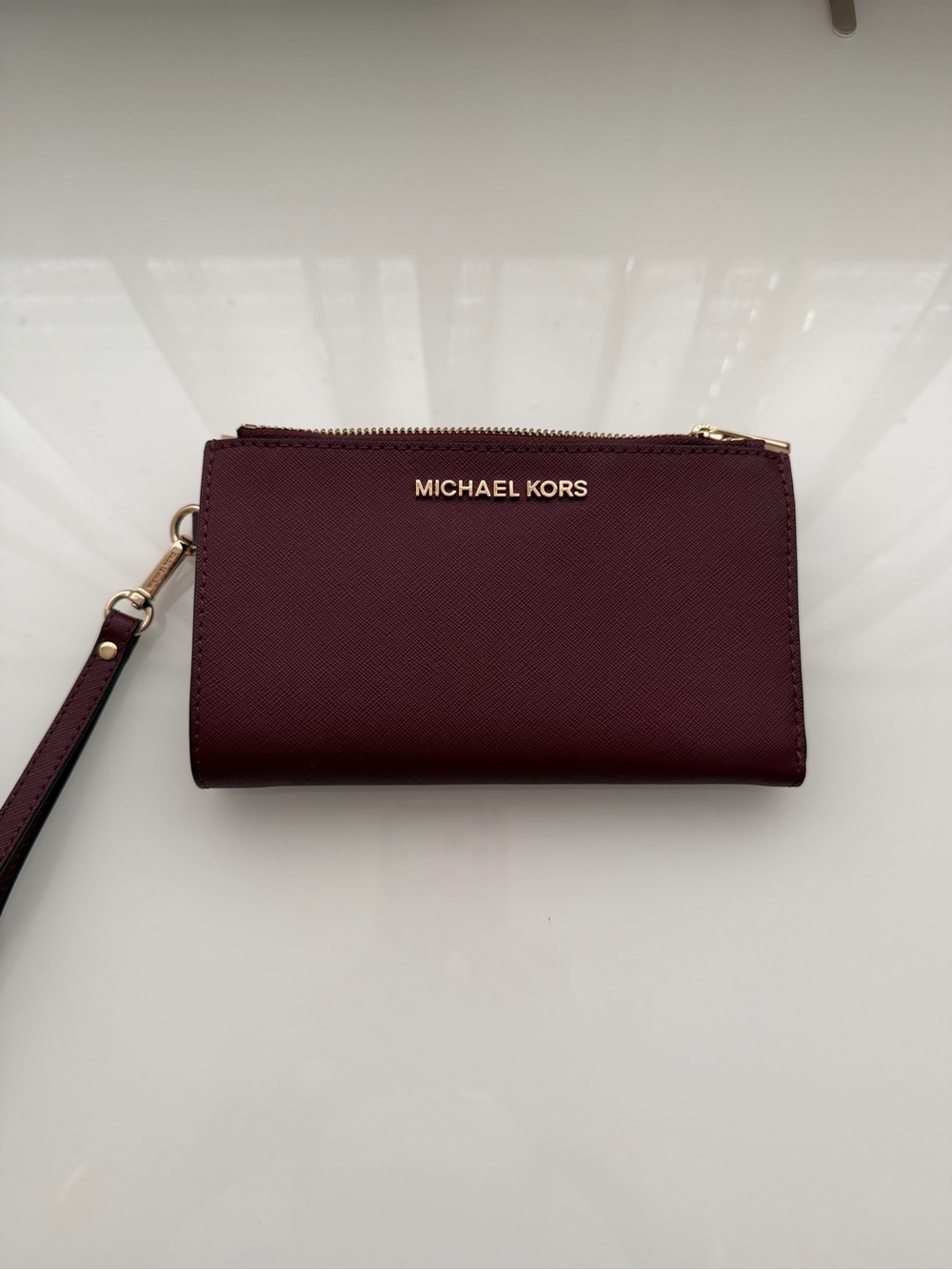 Michael Kors Wine Leather Wristlet with Gold Hardware